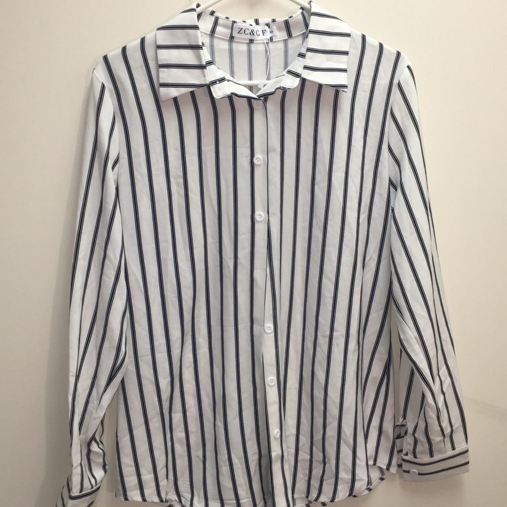 Womens black and white silky blouse. Brand new